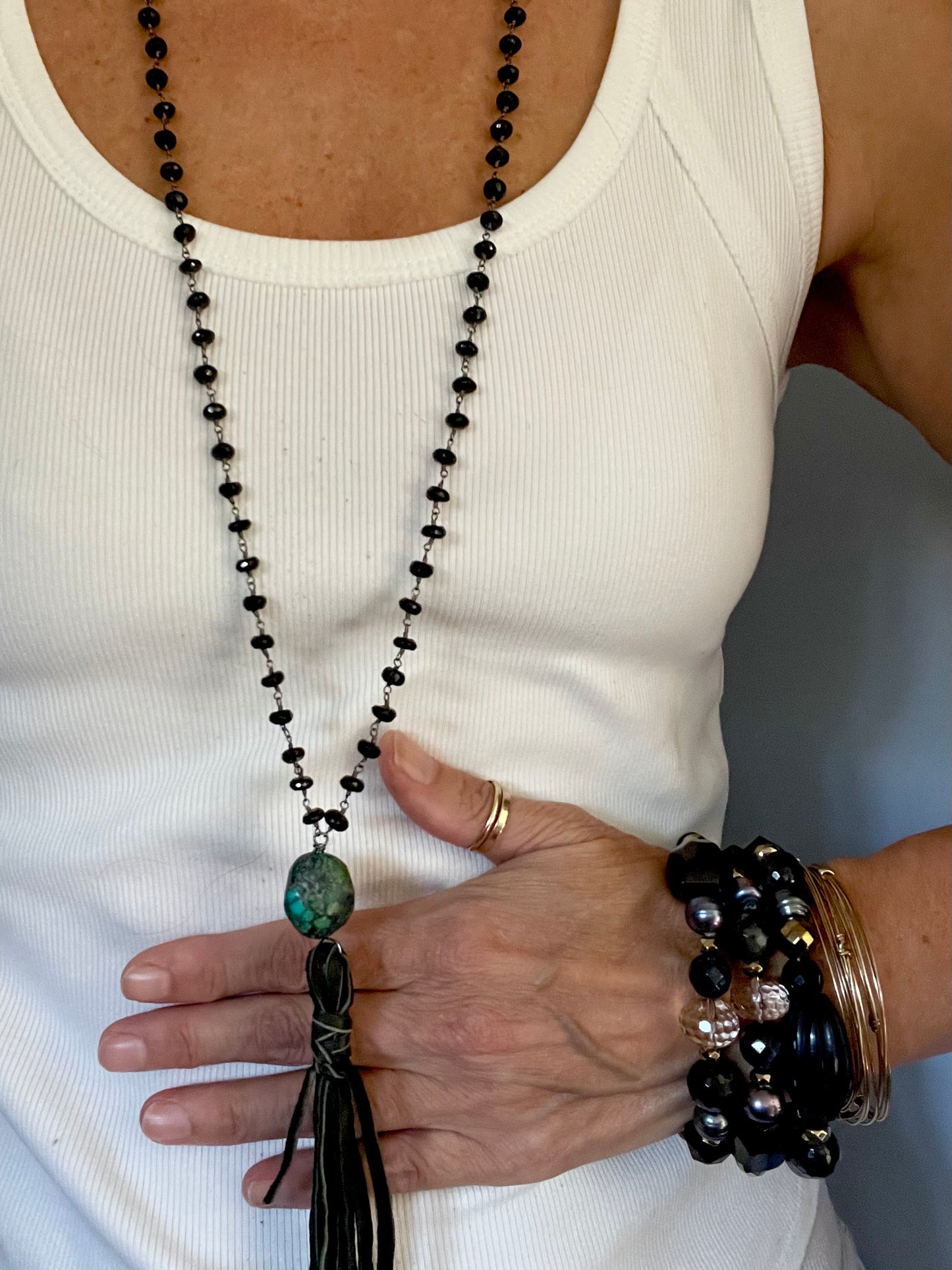 Black spinel and deer suede tassel necklace