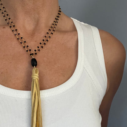 Black spinel and golden deer suede tassel