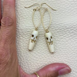 ghost skull earrings on gold hoops